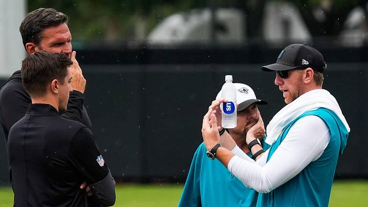 Jacksonville Jaguars head coach Liam Coen, right, talks with General Manager of the Jacksonville Jaguars James Gladstone, left and executive vice president of football operations Tony Boselli after the second day of minicamp at the Miller Electric Center, Wednesday, June 10, 2026, in Jacksonville. [Doug Engle/Florida Times-Union]