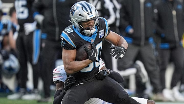 Dec 22, 2024; Charlotte, North Carolina, USA; Carolina Panthers running back Chuba Hubbard (30) is tackled by Arizona Cardinals safety Jalen Thompson (34) during the second half at Bank of America Stadium. Mandatory Credit: Jim Dedmon-Imagn Images Dec 22, 2024; Charlotte, North Carolina, USA; Carolina Panthers running back Chuba Hubbard (30) is tackled by Arizona Cardinals safety Jalen Thompson (34) during the second half at Bank of America Stadium. Mandatory Credit: Jim Dedmon-Imagn Images