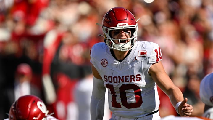 Oklahoma quarterback John Mateer communicates with the offensive line before a snap.