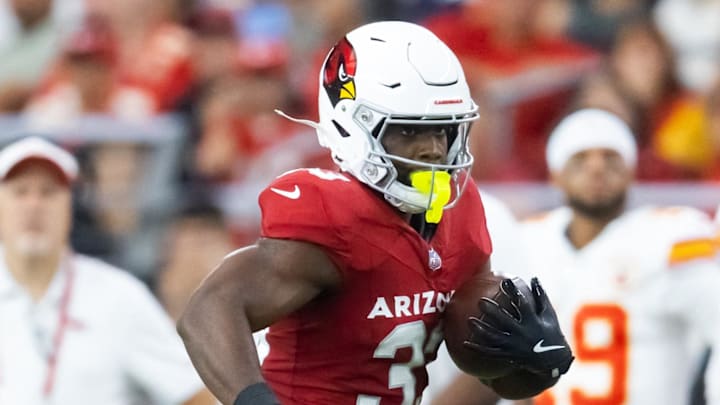 Aug 9, 2025; Glendale, Arizona, USA; Arizona Cardinals running back Trey Benson (33) against the Kansas City Chiefs during a preseason NFL game at State Farm Stadium. Mandatory Credit: Mark J. Rebilas-Imagn Images Aug 9, 2025; Glendale, Arizona, USA; Arizona Cardinals running back Trey Benson (33) against the Kansas City Chiefs during a preseason NFL game at State Farm Stadium. Mandatory Credit: Mark J. Rebilas-Imagn Images