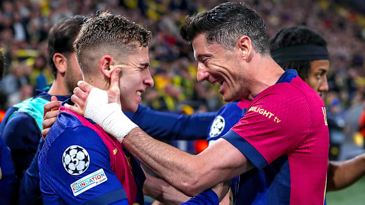 Fermín López (left) and Robert Lewandowski (right) celebrate Barcelona's goal in the second leg vs. Borussia Dortmund.