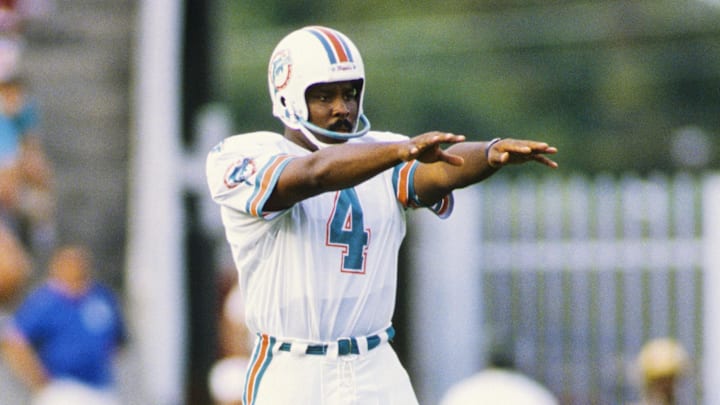 Oct 30, 1988; Tampa, FL, USA; FILE PHOTO; Miami Dolphins punter Reggie Roby (4) on the field against the Tampa Bay Buccaneers at Tampa Stadium during the 1988 season. Mandatory Credit: RVR Photots-Imagn Images