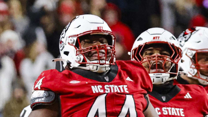 Nov 29, 2025; Raleigh, North Carolina, USA;  NC State Wolfpack defensive tackle Brandon Cleveland (44) reacts to his tackle during the first half of the game against North Carolina Tar Heels at Carter-Finley Stadium.  Mandatory Credit: Jaylynn Nash-Imagn Images