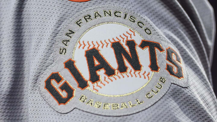 A detailed view of the San Francisco Giants logo on the sleeve of a player.