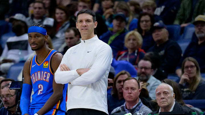 Dec 7, 2024; New Orleans, Louisiana, USA;  Oklahoma City Thunder head coach Mark Daigneault and Oklahoma City Thunder guard Shai Gilgeous-Alexander (2) watch the New Orleans Pelicans during the first half at Smoothie King Center. Mandatory Credit: Matthew Hinton-Imagn Images