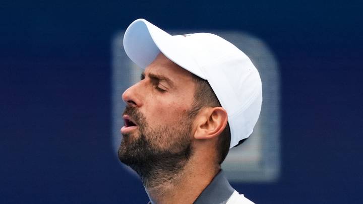 Novak Djokovic reacts after losing a point