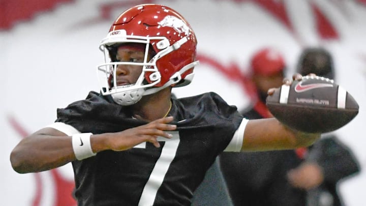 Arkansas Razorbacks quarterback KJ Jackson throws a pass during spring practice drills at the indoor practice center in Fayetteville, Ark.