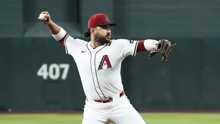 Arizona Diamondbacks third baseman Eugenio Suarez fields the ball and throws out Houston Astros' Yainer Diaz in the first inning at Chase Field in Phoenix on July 23, 2025.