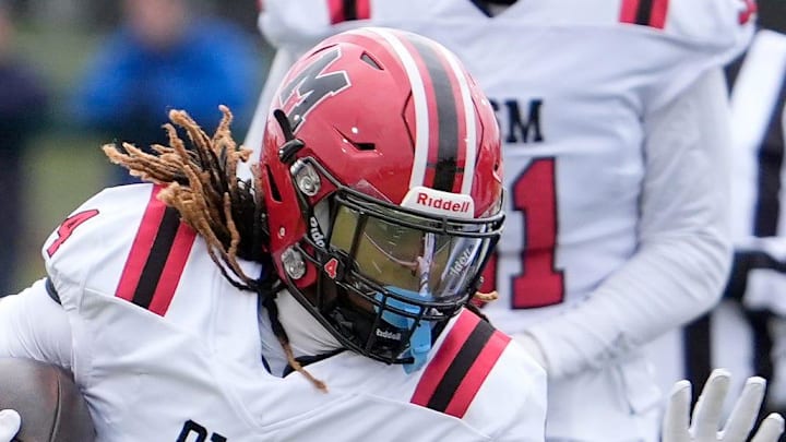 Orchard Lake St. Mary’s wide receiver Bryson Williams runs for extra yardage against the Birmingham Groves defense during first half action between the two schools n the MHSAA Division 2 semifinal game at West Bloomfield High School in West Bloomfield on Saturday, Nov. 23, 2024.
Orchard Lake St. Mary’s won the game 28-27 in one overtime.