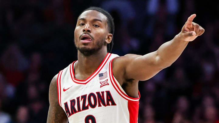Dec 29, 2025; Tucson, Arizona, USA; Arizona Wildcats guard Jaden Bradley (0) points to the bench after making a three-point basket against the South Dakota State Jackrabbits at McKale Memorial Center. Mandatory Credit: Aryanna Frank-Imagn Images