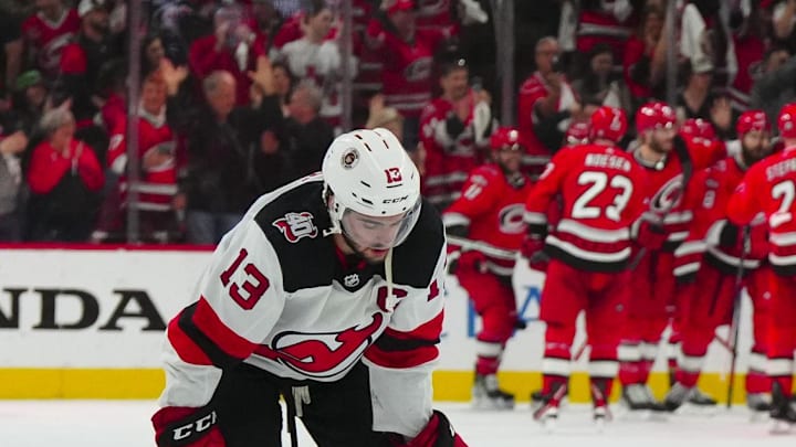 May 11, 2023; Raleigh, North Carolina, USA; New Jersey Devils center Nico Hischier (13) reacts after their loss against the Carolina Hurricanes in overtime in game five of the second round of the 2023 Stanley Cup Playoffs at PNC Arena. Mandatory Credit: James Guillory-Imagn Images