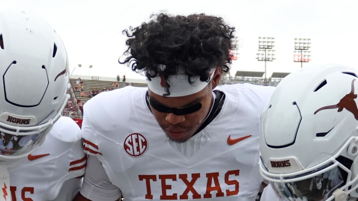Oct 25, 2025; Starkville, Mississippi, USA; Texas Longhorns defensive backs Xavier Filsaime (17), Jonah Williams (9) and Jordon Johnson-Rubell (23) huddle up during warm ups prior to the game against the Mississippi State Bulldogs at Davis Wade Stadium at Scott Field. Mandatory Credit: Petre Thomas-Imagn Images