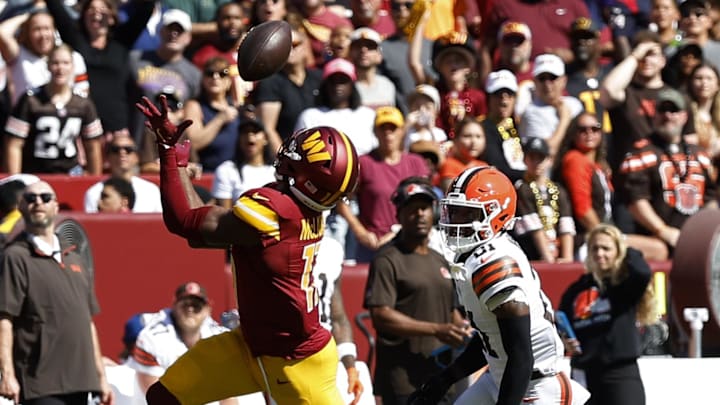 Oct 6, 2024; Landover, Maryland, USA; Washington Commanders wide receiver Terry McLaurin (17) catches a pass as Cleveland Browns cornerback Denzel Ward (21) chases during the first quarter at NorthWest Stadium. Mandatory Credit: Geoff Burke-Imagn Images