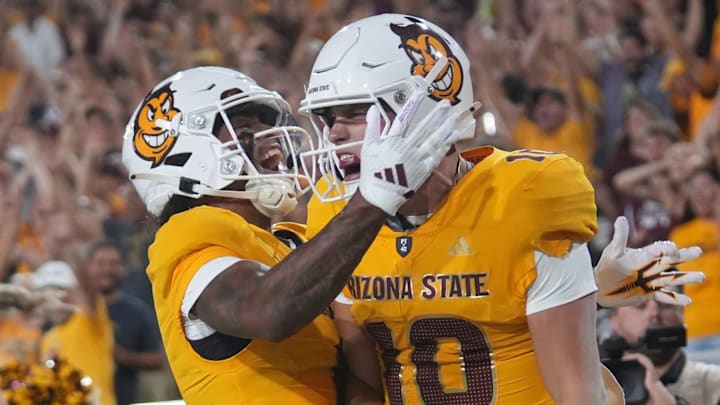 ASU Sun Devils quarterback Sam Leavitt (10) celebrates his touchdown run with teammate Jordyn Tyson (0) Jordyn Tyson against the Mississippi State Bulldogs at Mountain America Stadium in Tempe on Sept. 7, 2024. ASU Sun Devils quarterback Sam Leavitt (10) celebrates his touchdown run with teammate Jordyn Tyson (0) Jordyn Tyson against the Mississippi State Bulldogs at Mountain America Stadium in Tempe on Sept. 7, 2024.