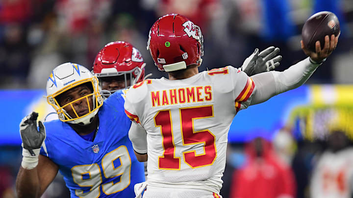 Dec 16, 2021; Inglewood, California, USA; Los Angeles Chargers defensive end Jerry Tillery (99) moves in against Kansas City Chiefs quarterback Patrick Mahomes (15) during the second half at SoFi Stadium. Mandatory Credit: Gary A. Vasquez-Imagn Images