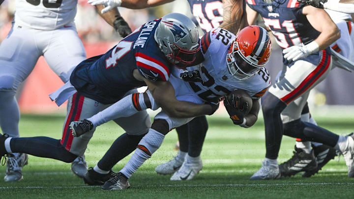 Oct 26, 2025; Foxborough, Massachusetts, USA;  New England Patriots linebacker Robert Spillane (14) tackles Cleveland Browns running back Dylan Sampson (22) during the third quarter at Gillette Stadium. Mandatory Credit: Brian Fluharty-Imagn Images