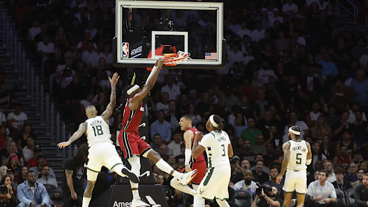 Nov 26, 2025; Miami, Florida, USA; Miami Heat center Bam Adebayo (13) dunks against the Milwaukee Bucks during the first half of an NBA Cup game at Kaseya Center. Mandatory Credit: Rhona Wise-Imagn Images