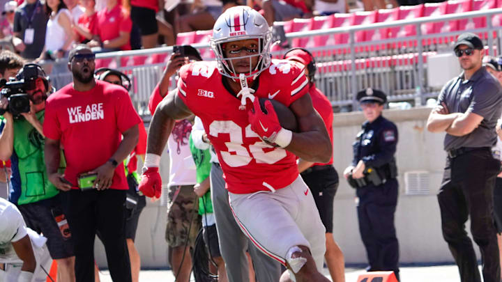 Sep 21, 2024; Columbus, Ohio, USA; Ohio State Buckeyes running back TreVeyon Henderson (32) runs the ball against the Marshall Thundering Herd in the second half at Ohio Stadium on Saturday.