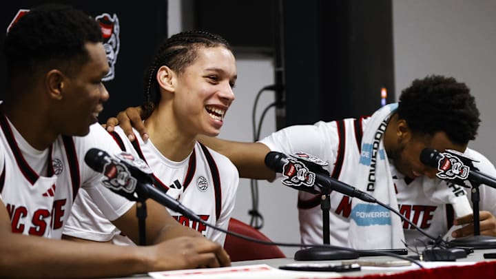 Dec 6, 2025; Raleigh, North Carolina, USA; NC State Wolfpack guard Quadir Copeland (11) gets emotional over guard Matt Able (3) praise for him during the presser of the game against the Liberty Flames at Lenovo Center. Mandatory Credit: Jaylynn Nash-Imagn Images