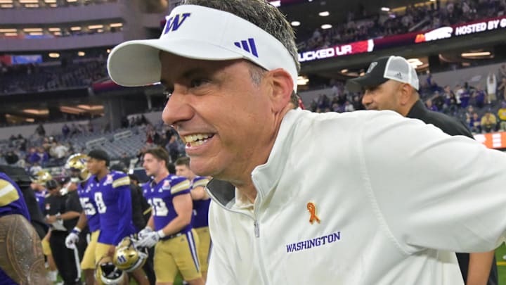 Dec 13, 2025; Inglewood, CA, USA;  Washington Huskies head coach Jedd Fisch runs on to the field after defeating the Boise State Broncos in the LA Bowl at SoFi Stadium. Mandatory Credit: Jayne Kamin-Oncea-Imagn Images