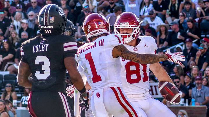 Oklahoma tight end Rocky Beers celebrates with Isaiah Sategna after scoring a touchdown against Mississippi State. Oklahoma tight end Rocky Beers celebrates with Isaiah Sategna after scoring a touchdown against Mississippi State.