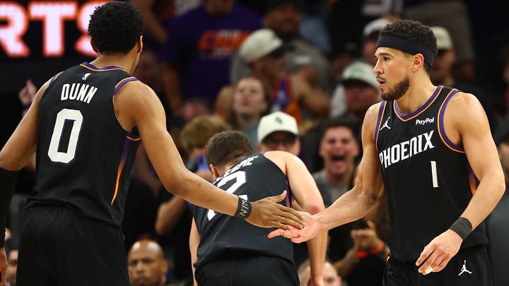 Apr 14, 2026; Phoenix, Arizona, USA; Phoenix Suns guard Devin Booker (1) celebrates with Ryan Dunn (0) against the Portland Trail Blazers in the second half during the play-in rounds of the 2026 NBA Playoffs at Mortgage Matchup Center. Mandatory Credit: Mark J. Rebilas-Imagn Images Apr 14, 2026; Phoenix, Arizona, USA; Phoenix Suns guard Devin Booker (1) celebrates with Ryan Dunn (0) against the Portland Trail Blazers in the second half during the play-in rounds of the 2026 NBA Playoffs at Mortgage Matchup Center. Mandatory Credit: Mark J. Rebilas-Imagn Images