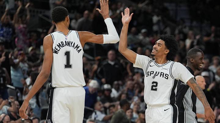 Oct 26, 2025; San Antonio, Texas, USA; San Antonio Spurs forward Victor Wembanyama (1) and guard Dylan Harper (2) celebrates in the second half against the Brooklyn Nets at Frost Bank Center. Mandatory Credit: Daniel Dunn-Imagn Images Oct 26, 2025; San Antonio, Texas, USA; San Antonio Spurs forward Victor Wembanyama (1) and guard Dylan Harper (2) celebrates in the second half against the Brooklyn Nets at Frost Bank Center. Mandatory Credit: Daniel Dunn-Imagn Images