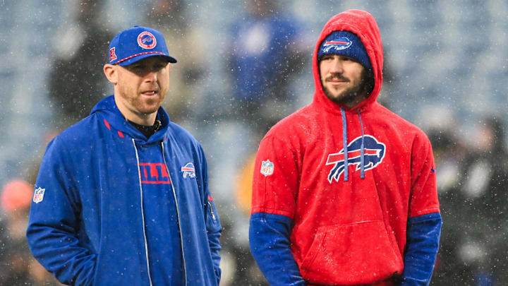 Buffalo Bills quarterback Josh Allen (17) speaks with Buffalo Bills Offensive Coordinator Joe Brady before the game against the Baltimore Ravens in a 2025 AFC divisional round game at Highmark Stadium.
