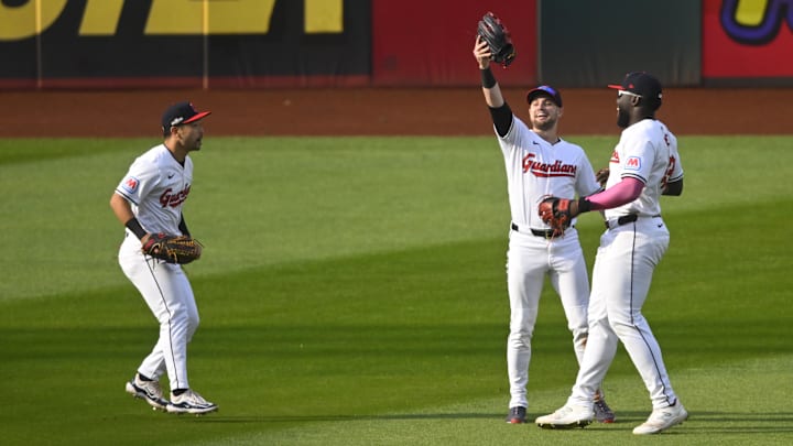 Oct 12, 2024; Cleveland, Ohio, USA; Cleveland Guardians outfielder Steven Kwan (38) outfielder Lane Thomas (8) and outfielder Jhonkensy Noel (43) celebrate after defeating the Detroit Tigers during game five of the ALDS for the 2024 MLB Playoffs at Progressive Field. Mandatory Credit: David Richard-Imagn Images