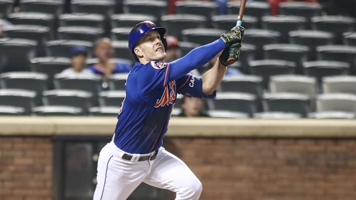 Jul 27, 2023; New York City, New York, USA; New York Mets left fielder Mark Canha (19) hits a sacrifice fly in the eighth inning against the Washington Nationals at Citi Field. Mandatory Credit: Wendell Cruz-Imagn Images Jul 27, 2023; New York City, New York, USA; New York Mets left fielder Mark Canha (19) hits a sacrifice fly in the eighth inning against the Washington Nationals at Citi Field. Mandatory Credit: Wendell Cruz-Imagn Images