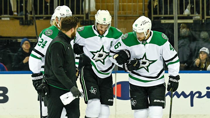 Dec 2, 2025; New York, New York, USA;  Dallas Stars center Tyler Seguin (91) helped off the ice by Dallas Stars center Roope Hintz (24) and Dallas Stars defenseman Ilya Lyubushkin (46) in the game against the New York Rangers during the first period at Madison Square Garden. Mandatory Credit: Dennis Schneidler-Imagn Images