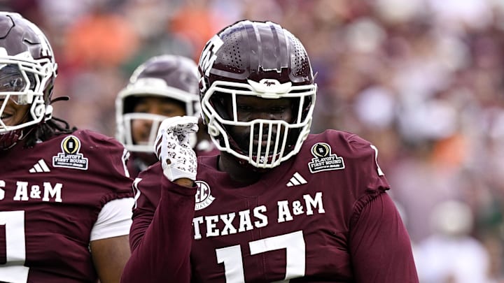 Dec 20, 2025; College Station, TX, USA; Texas A&M Aggies defensive tackle Albert Regis (17) and defensive tackle Tyler Onyedim (11) celebrate during the game between the Aggies and the Hurricanes at Kyle Field. Mandatory Credit: Jerome Miron-Imagn Images