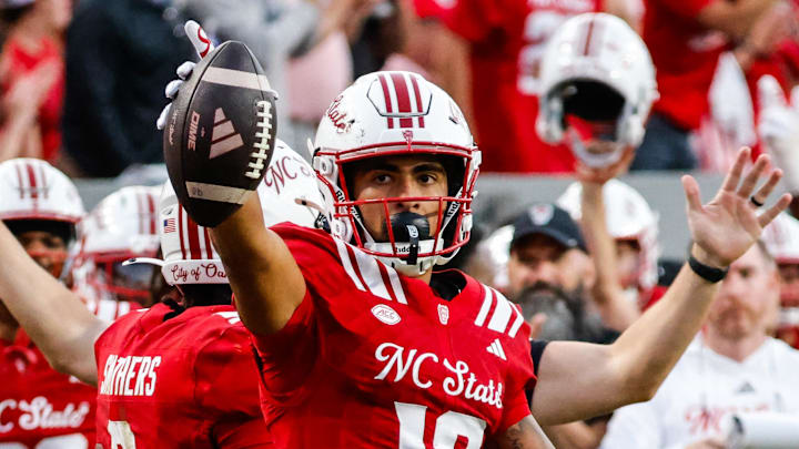 Aug 28, 2025; Raleigh, North Carolina, USA; North Carolina State Wolfpack wide receiver Teddy Hoffmann (12)  celebrates a down during the first half of the game against East Carolina Pirates at Carter-Finley Stadium. Mandatory Credit: Jaylynn Nash-Imagn Images