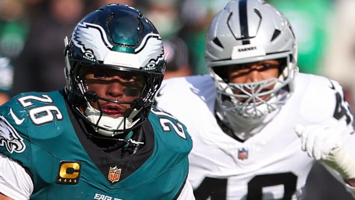Dec 14, 2025; Philadelphia, Pennsylvania, USA; Philadelphia Eagles running back Saquon Barkley (26) runs the ball against the Las Vegas Raiders during the first quarter at Lincoln Financial Field. Mandatory Credit: Bill Streicher-Imagn Images