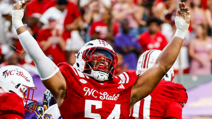 Aug 28, 2025; Raleigh, North Carolina, USA; North Carolina State Wolfpack defensive end Sabastian Harsh (54) celebrates a sack during the first half of the game against East Carolina Pirates at Carter-Finley Stadium. Mandatory Credit: Jaylynn Nash-Imagn Images Aug 28, 2025; Raleigh, North Carolina, USA; North Carolina State Wolfpack defensive end Sabastian Harsh (54) celebrates a sack during the first half of the game against East Carolina Pirates at Carter-Finley Stadium. Mandatory Credit: Jaylynn Nash-Imagn Images