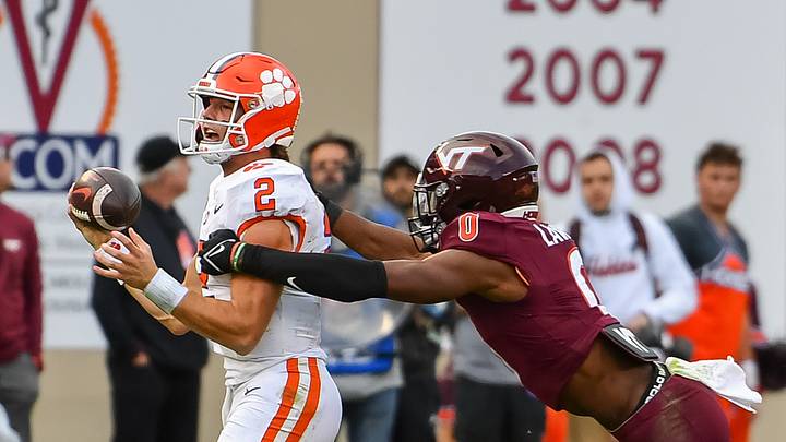 Nov 9, 2024; Blacksburg, Va.; Virginia Tech linebacker Keli Lawson (0) tackles Clemson quarterback Cade Klubnik (2). Nov 9, 2024; Blacksburg, Va.; Virginia Tech linebacker Keli Lawson (0) tackles Clemson quarterback Cade Klubnik (2).