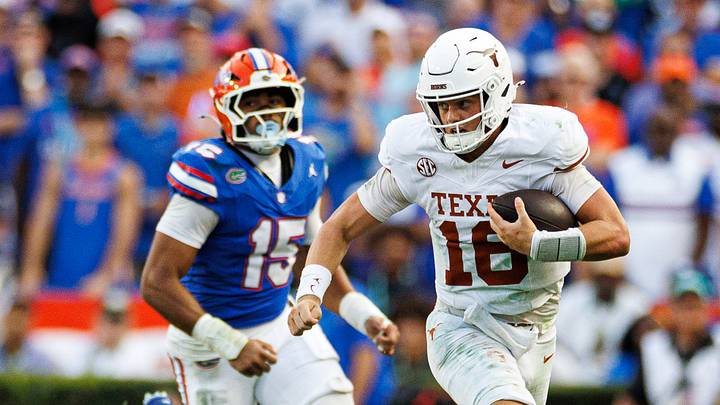 Texas Longhorns quarterback Arch Manning (16) runs with the ball while Florida Gators defensive end Jayden Woods (15) chases during the second half at Ben Hill Griffin Stadium. Texas Longhorns quarterback Arch Manning (16) runs with the ball while Florida Gators defensive end Jayden Woods (15) chases during the second half at Ben Hill Griffin Stadium.