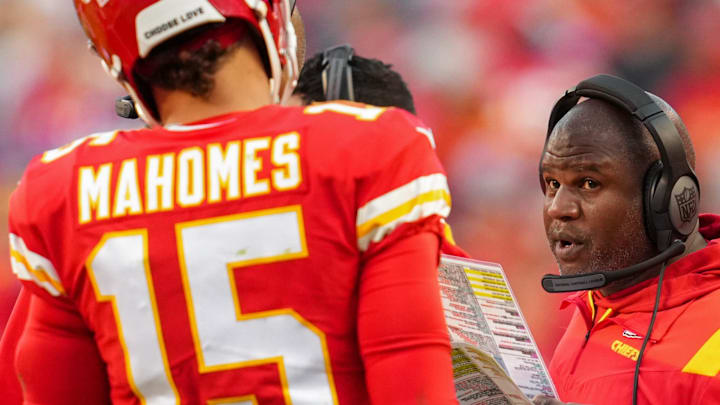 Oct 16, 2022; Kansas City, Missouri, USA; Kansas City Chiefs offensive coordinator Eric Bieniemy talks with quarterback Patrick Mahomes (15) during the second half against the Buffalo Bills at GEHA Field at Arrowhead Stadium. Mandatory Credit: Jay Biggerstaff-Imagn Images