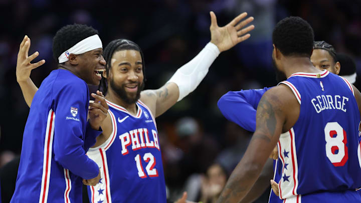 Mar 25, 2026; Philadelphia, Pennsylvania, USA; Philadelphia 76ers guard Vj Edgecombe and forward Trendon Watford (12) react with Paul George after his three pointer against the Chicago Bulls during the fourth quarter at Xfinity Mobile Arena. Mandatory Credit: Bill Streicher-Imagn Images