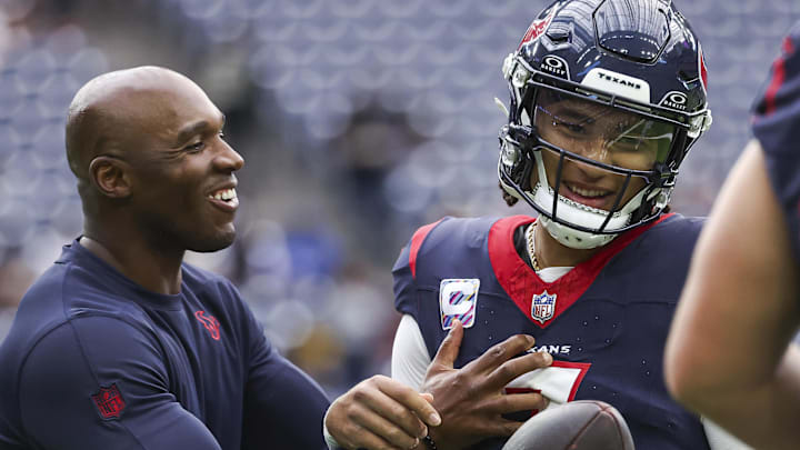 Oct 15, 2023; Houston, Texas, USA; Houston Texans head coach DeMeco Ryans laughs with quarterback C.J. Stroud (7) before the game against the New Orleans Saints at NRG Stadium. Mandatory Credit: Troy Taormina-Imagn Images