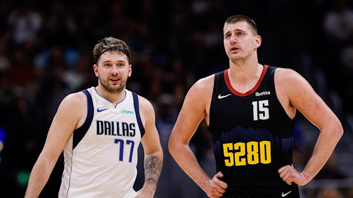 Dec 18, 2023; Denver, Colorado, USA; Dallas Mavericks guard Luka Doncic (77) and Denver Nuggets center Nikola Jokic (15) in the second quarter at Ball Arena. Mandatory Credit: Isaiah J. Downing-USA TODAY Sports