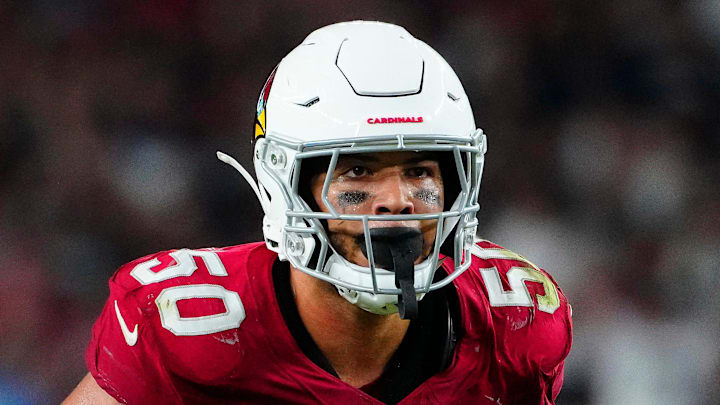 Cardinals linebacker Cody Simon (50) looks over the Raiders' offensive line during a preseason game at State Farm Stadium in Glendale on Aug. 23, 2025.
