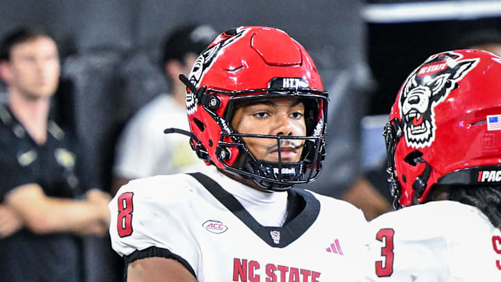 Sep 11, 2025; Winston-Salem, North Carolina, USA;  North Carolina State Wolfpack wide receiver Terrell Anderson (9) celebrates a touchdown with North Carolina State Wolfpack running back Hollywood Smothers (3) against Wake Forest Demon Deacons at Allegacy Federal Credit Union Stadium. 