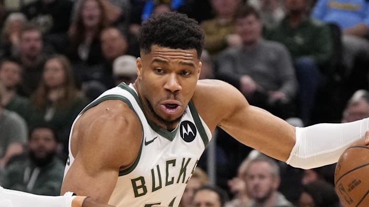 Milwaukee Bucks forward Giannis Antetokounmpo drives for to the basket against Washington Wizards forward Khris Middleton.