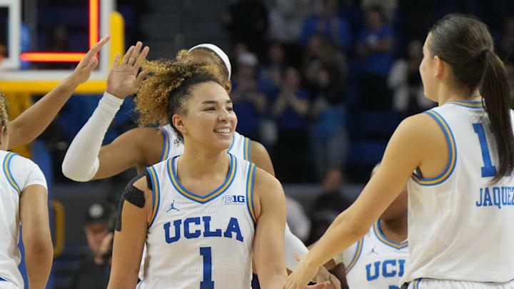 Feb 16, 2025; Los Angeles, California, USA; UCLA Bruins guard Avary Cain (2), forward Kendall Dudley (22) and guard Kiki Rice (1) and guard Gabriela Jaquez (11) celebrate at the end of the game against the UCLA Bruins at Pauley Pavilion presented by Wescom. Mandatory Credit: Kirby Lee-Imagn Images