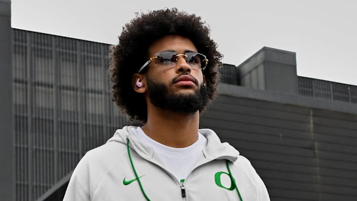 Oct 11, 2025; Eugene, Oregon, USA; Oregon Ducks quarterback Dante Moore (5) arrives with his teammates before the game against the Indiana Hoosiers at Autzen Stadium. Mandatory Credit: Troy Wayrynen-Imagn Images