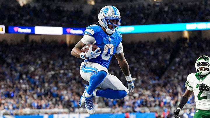 Detroit Lions running back Jahmyr Gibbs (0) leaps into the end zone for a touchdown against New York Jets during the second half at Ford Field in Detroit on Sunday, Sept. 27, 2026.