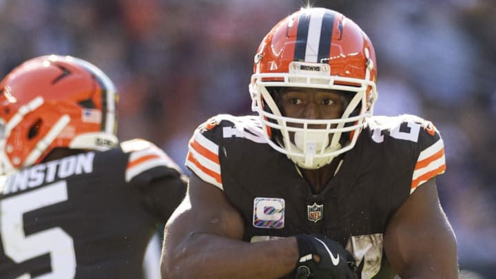 Oct 27, 2024; Cleveland, Ohio, USA; Cleveland Browns running back Nick Chubb (24) runs the ball against the Baltimore Ravens during the second quarter at Huntington Bank Field. Mandatory Credit: Scott Galvin-Imagn Images