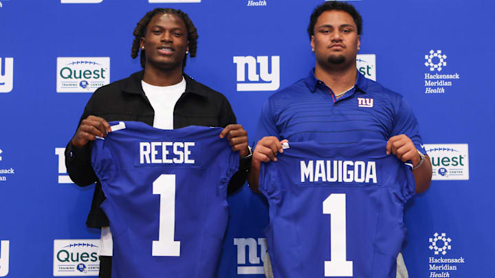 Apr 24, 2026; East Rutherford, NJ, USA; New York Giants draft picks Arvell Reese and Francis Mauigoa pose for a photo during the introductory press conference at Quest Diagnostics Training Center. Mandatory Credit: Tom Horak-Imagn Images