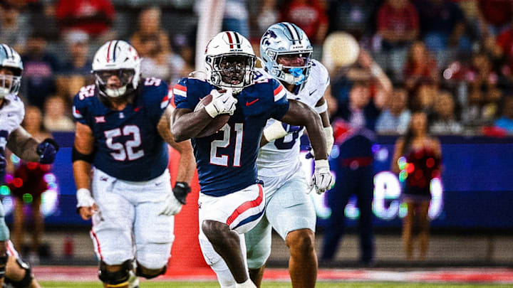 Arizona running back Ismail Mahdi breaking off a 60-yard run against KSU in the first half.